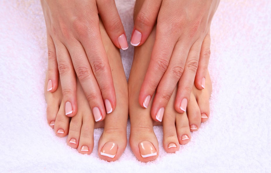 pedicure on legs and beautiful manicure  hands closeup